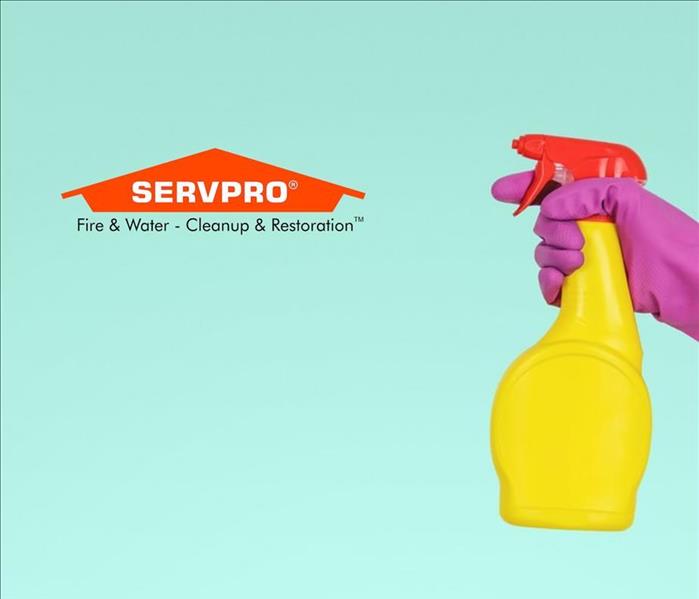 A blue background with an arm sticking out of the side holding a spray bottle and the SERVPRO logo