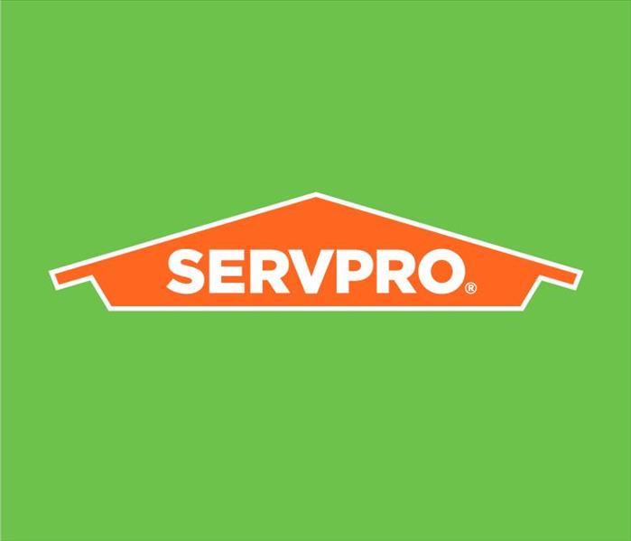 Green background and orange SERVPRO sign